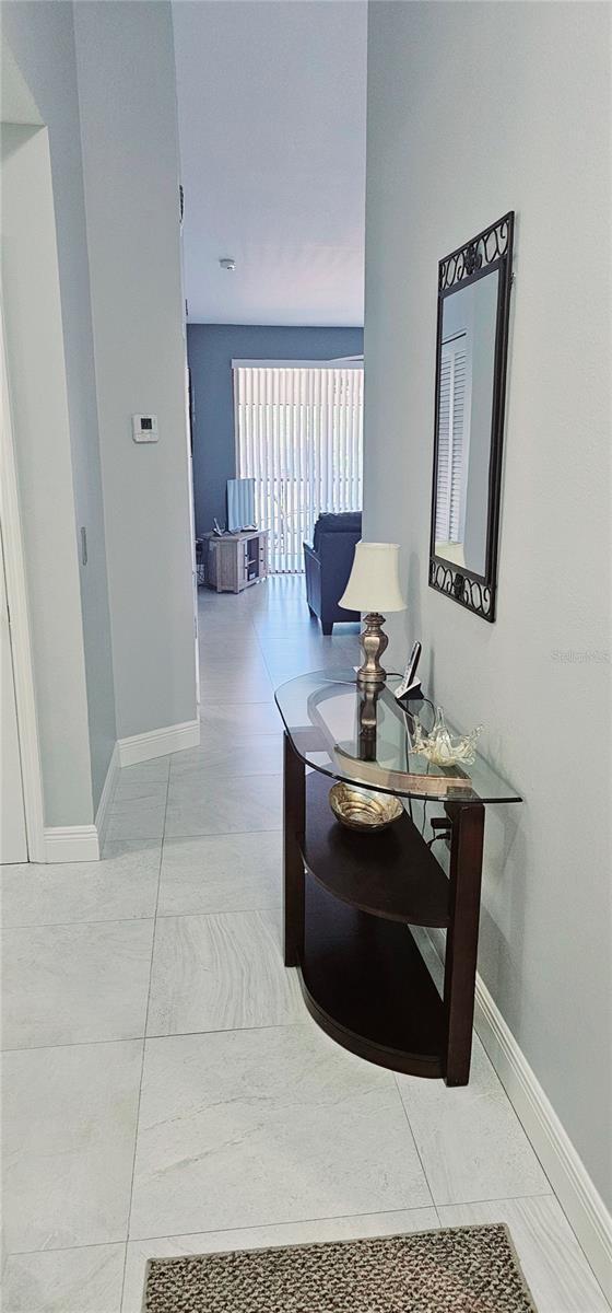 4415 45th Ave W Unit 203, Bradenton, FL 34210 - hallway with baseboards and tile patterned flooring