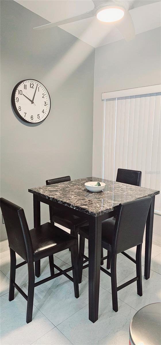 4415 45th Ave W Unit 203, Bradenton, FL 34210 - dining room featuring light tile patterned flooring