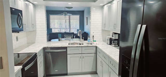 4415 45th Ave W Unit 203, Bradenton, FL 34210 - kitchen featuring a sink, decorative backsplash, a ceiling fan, and black appliances