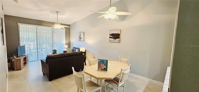 4415 45th Ave W Unit 203, Bradenton, FL 34210 - dining area with baseboards, a ceiling fan, high vaulted ceiling, and light tile patterned flooring
