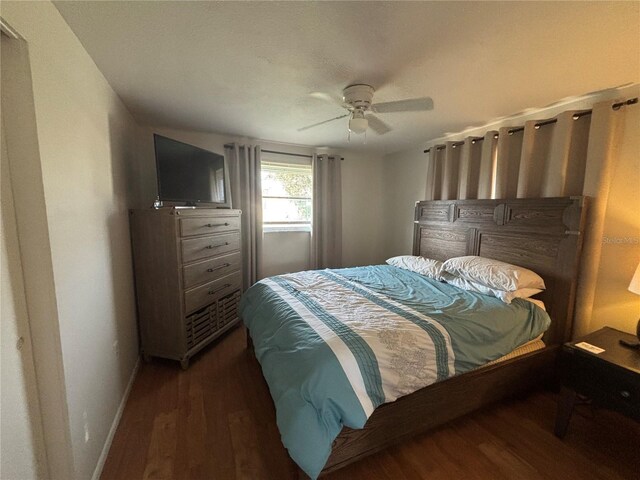 4411 Dolphin Ln, Palmetto, FL 34221 - bedroom featuring baseboards, ceiling fan, and wood finished floors
