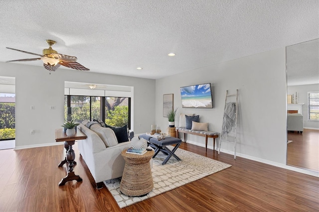 7374 Royal Birkdale Dr Unit 15D, Sarasota, FL 34238 - living area with a textured ceiling, recessed lighting, baseboards, a ceiling fan, and wood finished floors