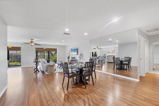 7374 Royal Birkdale Dr Unit 15D, Sarasota, FL 34238 - dining room with ceiling fan and light wood-style flooring