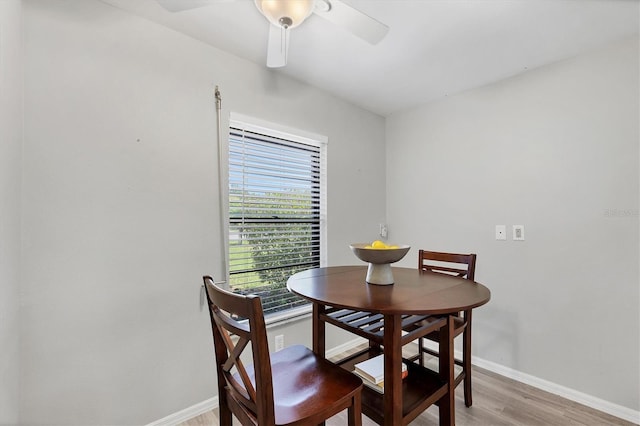 7374 Royal Birkdale Dr Unit 15D, Sarasota, FL 34238 - dining space featuring baseboards, light wood finished floors, and ceiling fan