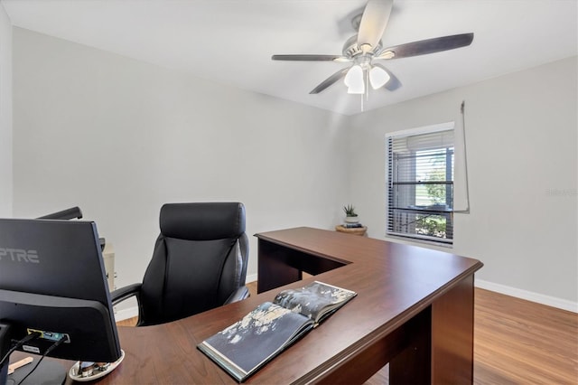 7374 Royal Birkdale Dr Unit 15D, Sarasota, FL 34238 - office area with a ceiling fan, baseboards, and wood finished floors