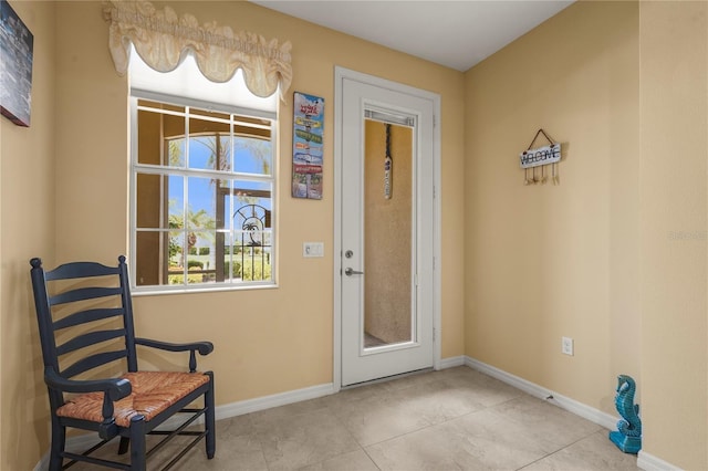 27243 Ipswich Dr, Englewood, FL 34223 - doorway to outside with baseboards and tile patterned floors