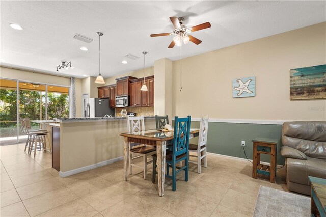 27243 Ipswich Dr, Englewood, FL 34223 - dining space featuring a ceiling fan, recessed lighting, light tile patterned flooring, and visible vents