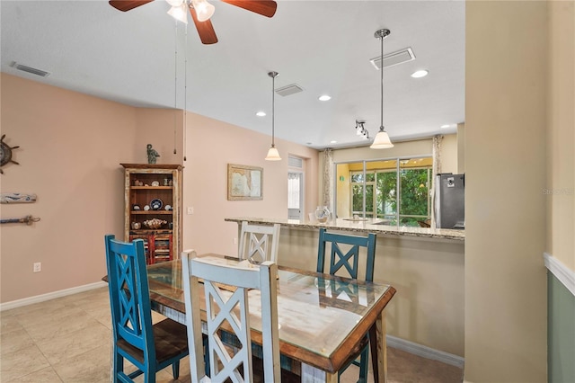 27243 Ipswich Dr, Englewood, FL 34223 - dining room with ceiling fan, recessed lighting, and visible vents