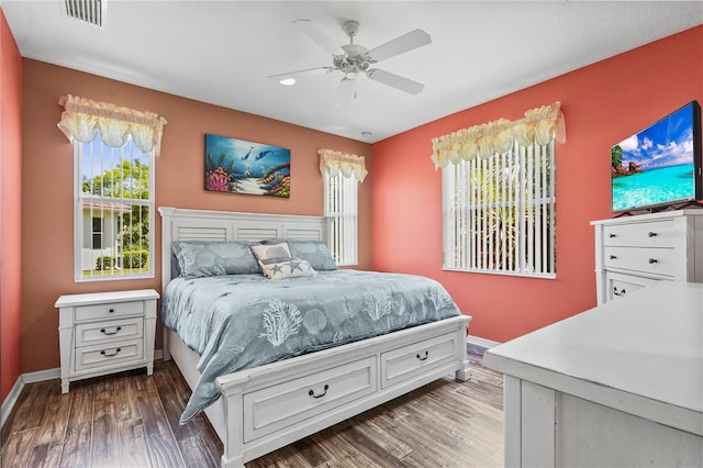 27243 Ipswich Dr, Englewood, FL 34223 - bedroom featuring baseboards, ceiling fan, wood finished floors, and visible vents