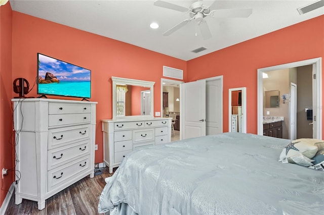 27243 Ipswich Dr, Englewood, FL 34223 - bedroom with visible vents, dark wood finished floors, and ensuite bath