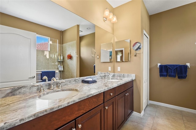 27243 Ipswich Dr, Englewood, FL 34223 - full bathroom featuring double vanity, a sink, a walk in shower, and baseboards