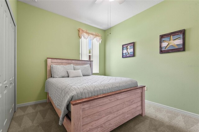 27243 Ipswich Dr, Englewood, FL 34223 - carpeted bedroom with a ceiling fan, baseboards, and a closet