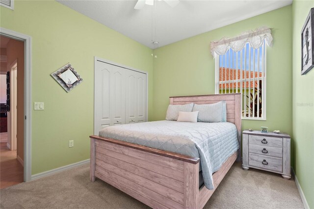 27243 Ipswich Dr, Englewood, FL 34223 - bedroom with a closet, baseboards, and light carpet