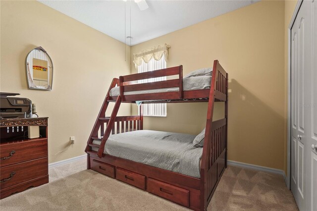 27243 Ipswich Dr, Englewood, FL 34223 - bedroom with a ceiling fan, baseboards, carpet, and a closet