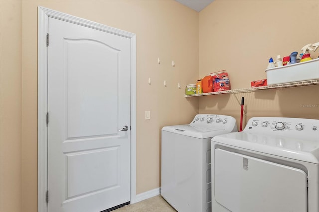 27243 Ipswich Dr, Englewood, FL 34223 - laundry area with laundry area, baseboards, and independent washer and dryer