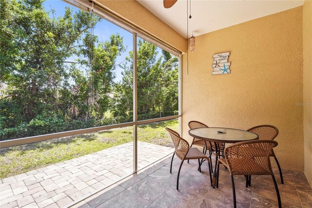 27243 Ipswich Dr, Englewood, FL 34223 - sunroom / solarium featuring a ceiling fan and outdoor dining area
