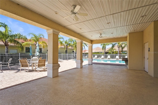 27243 Ipswich Dr, Englewood, FL 34223 - view of patio featuring a ceiling fan, a community pool, and fence