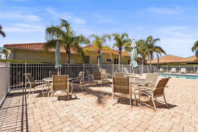 27243 Ipswich Dr, Englewood, FL 34223 - view of patio featuring fence, a community pool, and outdoor dining area