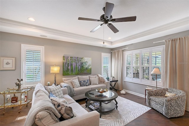 12133 Forest Park Cir, Bradenton, FL 34211 - living room featuring a raised ceiling, healthy amount of natural light, ceiling fan, baseboards, and recessed lighting