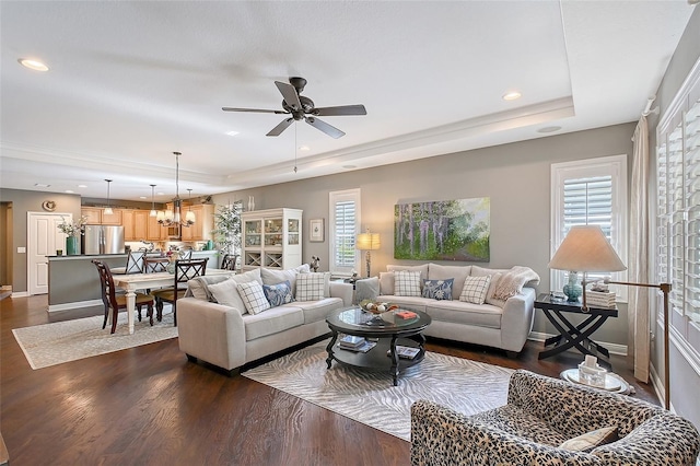 12133 Forest Park Cir, Bradenton, FL 34211 - living room featuring a tray ceiling, dark wood finished floors, ceiling fan, recessed lighting, and a chandelier