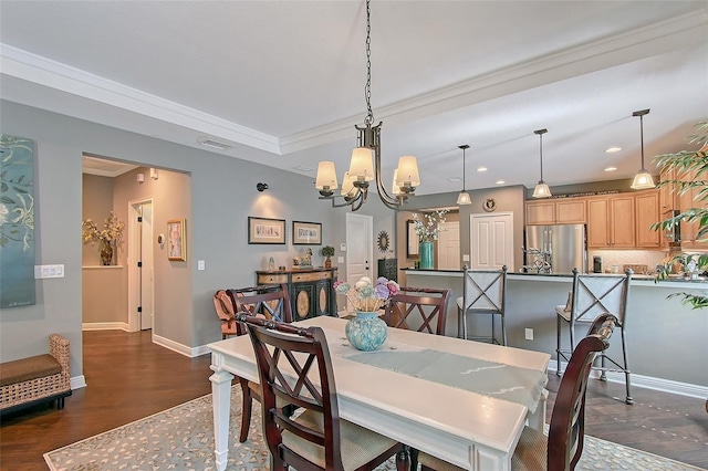 12133 Forest Park Cir, Bradenton, FL 34211 - dining space with a chandelier, dark wood-type flooring, recessed lighting, baseboards, and ornamental molding