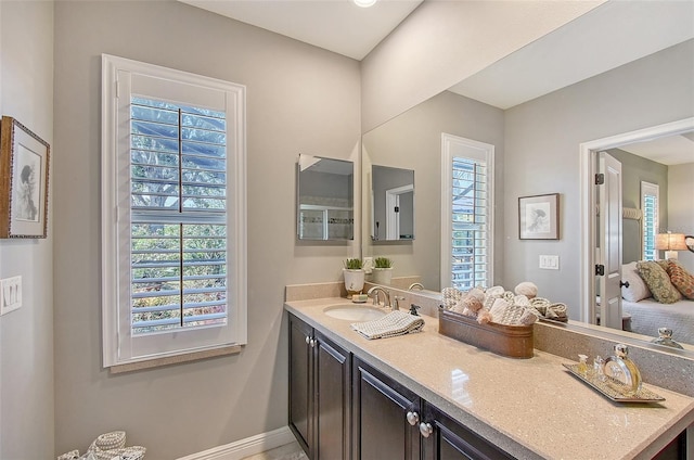 12133 Forest Park Cir, Bradenton, FL 34211 - bathroom featuring plenty of natural light, vanity, and baseboards