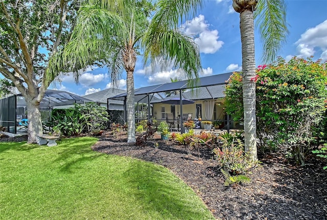 12133 Forest Park Cir, Bradenton, FL 34211 - back of property with a lawn and glass enclosure