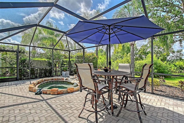 12133 Forest Park Cir, Bradenton, FL 34211 - view of patio with an in-ground hot tub, glass enclosure, and outdoor dining space
