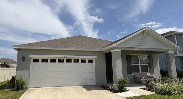 ranch-style house with an attached garage, stucco siding, driveway, and a porch