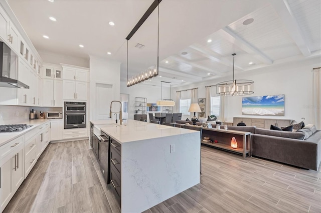 8195 Redonda Loop, Lakewood Ranch, FL 34202 - kitchen featuring light countertops, open floor plan, appliances with stainless steel finishes, and a sink