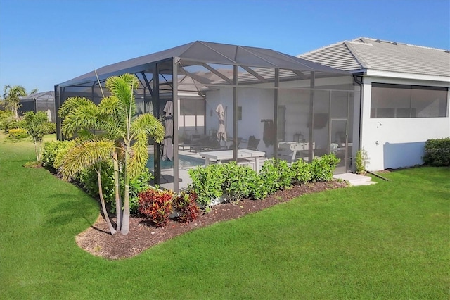 8195 Redonda Loop, Lakewood Ranch, FL 34202 - back of house with a lawn, a patio, a tile roof, and stucco siding