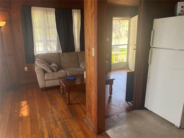 2415 Pelican Dr, Sarasota, FL 34237 - living room featuring wooden walls and hardwood / wood-style flooring