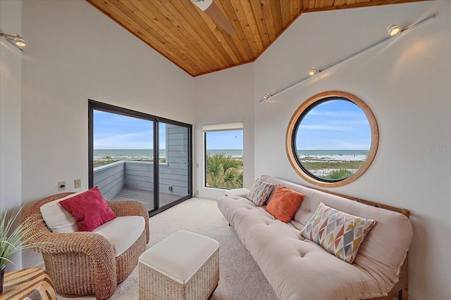 carpeted bedroom with wooden ceiling, access to outside, vaulted ceiling, and a water view