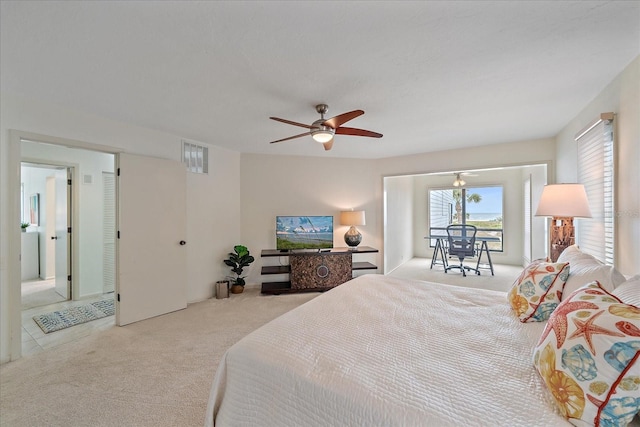 bedroom featuring carpet flooring, access to outside, and a ceiling fan