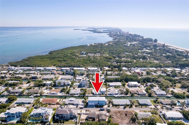 birds eye view of property with a residential view and a water view