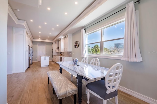 dining area featuring light wood-type flooring, recessed lighting, baseboards, and crown molding