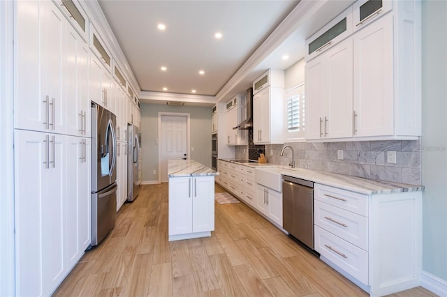 kitchen featuring a sink, stainless steel appliances, and white cabinetry