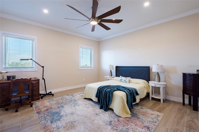 bedroom featuring crown molding, light wood finished floors, and baseboards