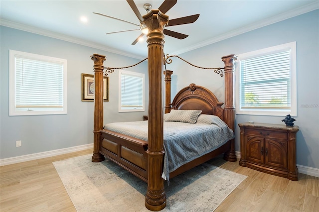 bedroom featuring light wood-style floors, baseboards, and ornamental molding