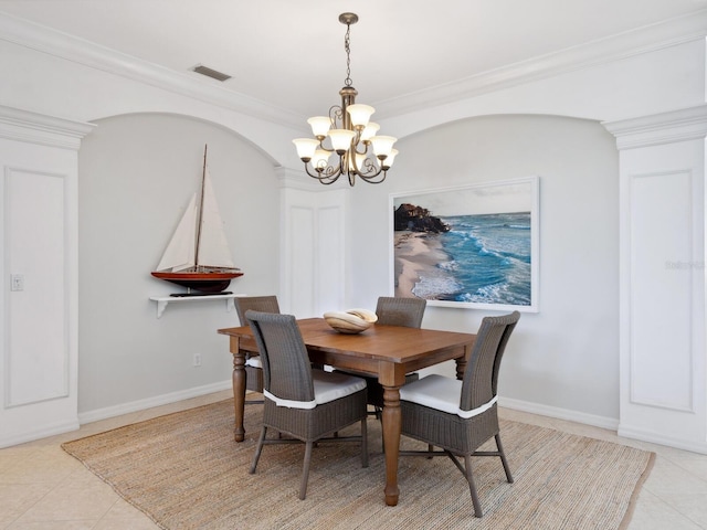 1313 Thornapple Dr, Osprey, FL 34229 - dining space featuring a chandelier, light tile patterned floors, crown molding, and baseboards