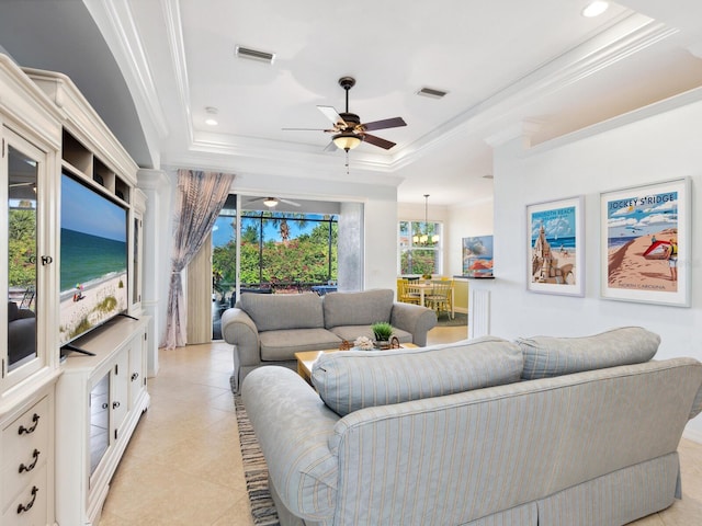 1313 Thornapple Dr, Osprey, FL 34229 - living room with a tray ceiling, crown molding, a ceiling fan, light tile patterned flooring, and recessed lighting