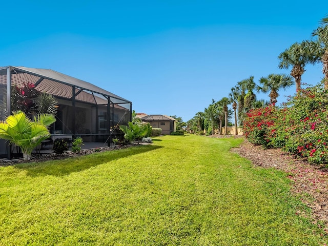 1313 Thornapple Dr, Osprey, FL 34229 - view of green lawn featuring a lanai
