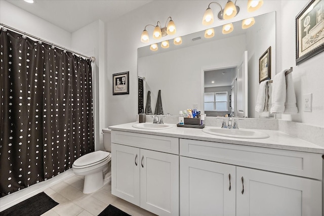 full bathroom with tile patterned flooring, a sink, double vanity, and toilet