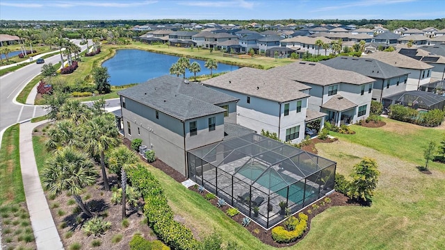 bird's eye view featuring a water view and a residential view
