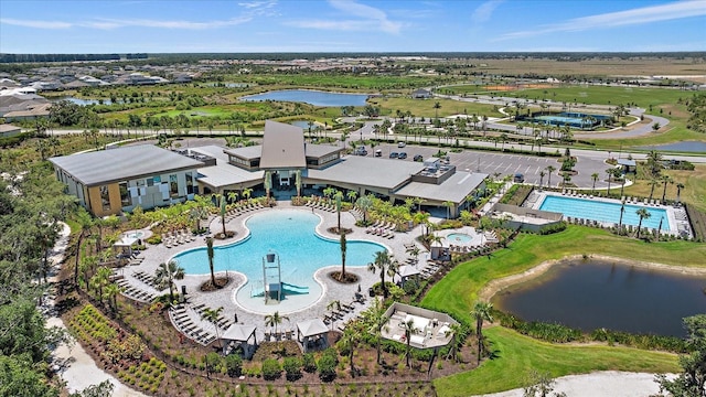 birds eye view of property with a water view