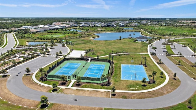 aerial view featuring a residential view and a water view