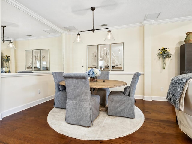 2525 Vaccaro Dr, Sarasota, FL 34231 - dining space featuring ornamental molding, wood finished floors, and visible vents