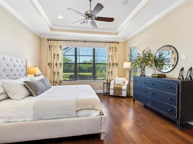 2525 Vaccaro Dr, Sarasota, FL 34231 - bedroom featuring crown molding, ceiling fan, dark wood-type flooring, recessed lighting, and a tray ceiling