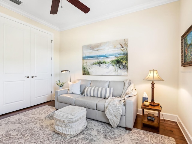 2525 Vaccaro Dr, Sarasota, FL 34231 - living area with crown molding, ceiling fan, baseboards, and wood finished floors