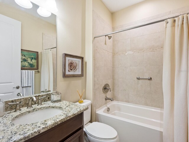 2525 Vaccaro Dr, Sarasota, FL 34231 - bathroom with toilet, shower / bath combo, and vanity